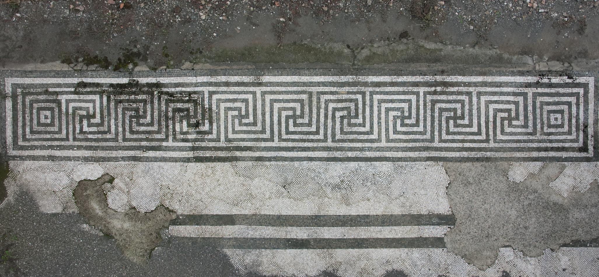 Mosaic strip between room 18 and Peristyle.